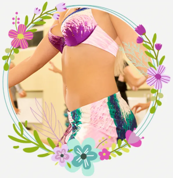 A belly dancer in a pink and purple costume, framed with painted flowers
